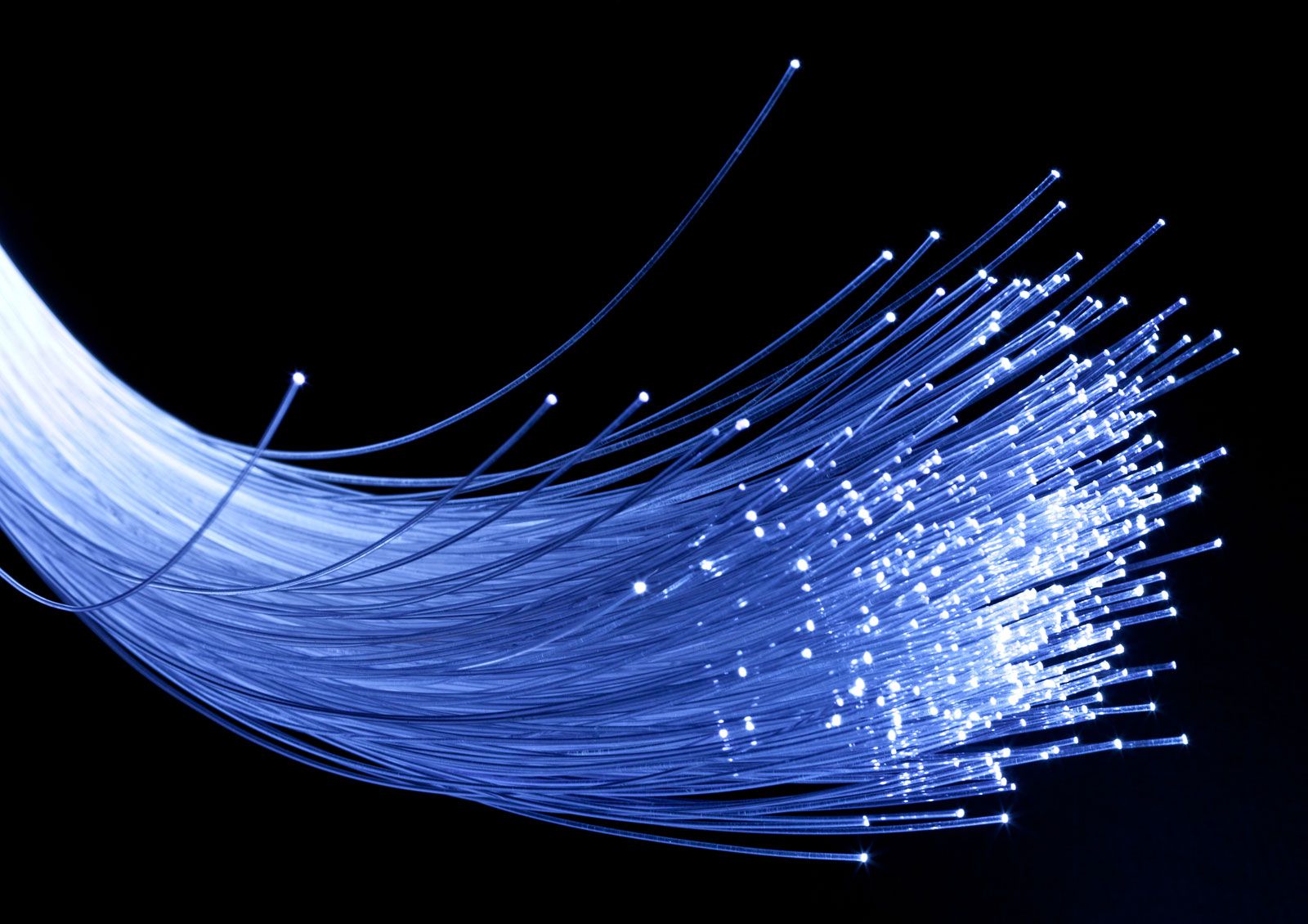 Fibre optic cables being installed in a Kenyan city street with technicians working